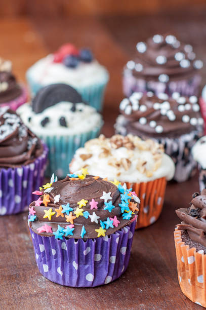 istock Colorful chocolate cupcakes with toppings 1414148985