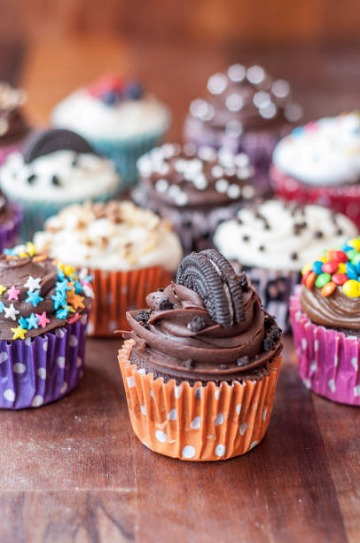istock Colorful chocolate cupcakes with toppings 1414149486