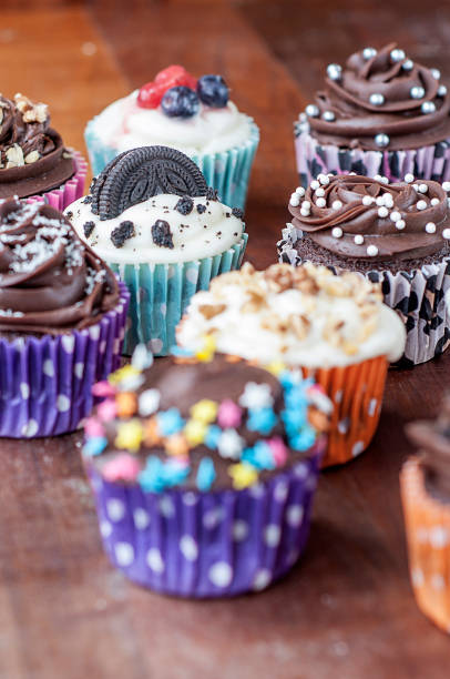 istock Colorful chocolate cupcakes with toppings 1414149487