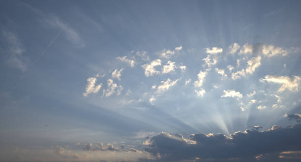 istock Glow through the clouds of the evening or morning sun 1414151372