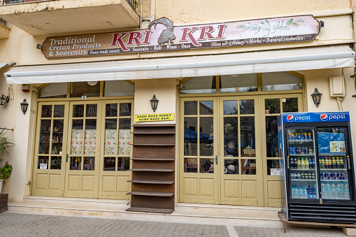 Traditional Cretan Products & Souvenirs Shop at Rethymnon Town on Crete, Greece. This is a commercial business with incidental people in the background.