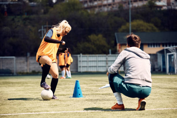 istock Athletic woman during soccer practice on playing field. 1414152950