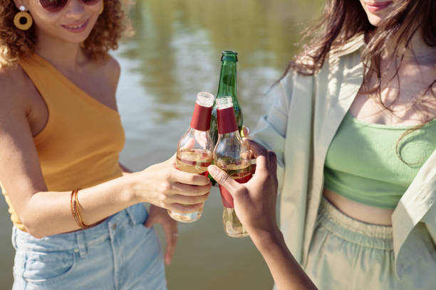 istock Friends Toasting with Beer Bottles Closeup 1414155667