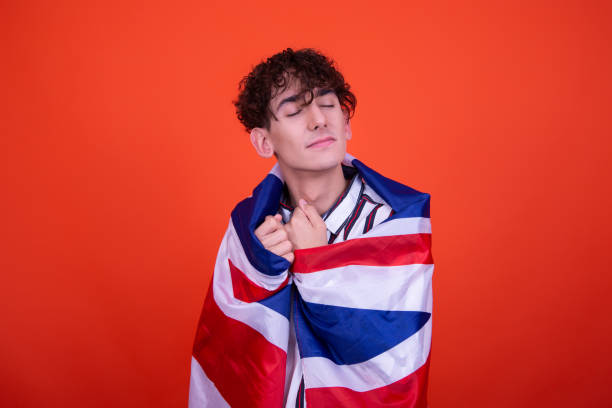 istock Young attractive guy with a flag posing in the studio. 1414157750