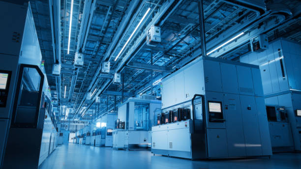 istock Wide Shot Inside Advanced Semiconductor Production Fab Cleanroom with Working Overhead Wafer Transfer System 1414159139