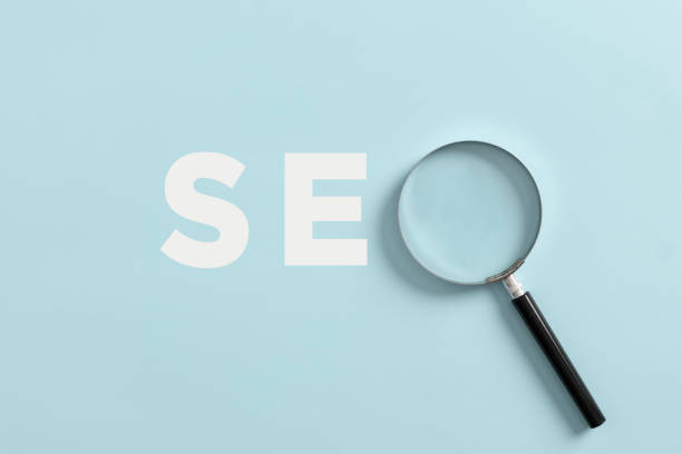 istock Magnifying glass with the word SEO search engine optimization. 1414162717