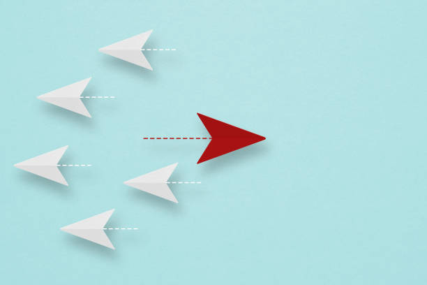 istock Red arrow paper heading difference way from group on grunge blue background ,metaphor for business creativity new idea, finding new normal way, individual and unique leader. copy space. paper cut 1414163104