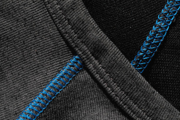 Dark grey shirt with blue seams, no person