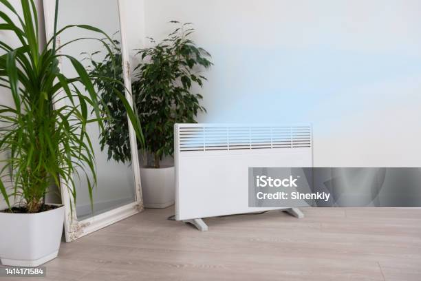 Modern Electric Infrared Heater In Living Room Stock Photo - Download Image Now - Electric Heater, Radiator - Heater, Infrared