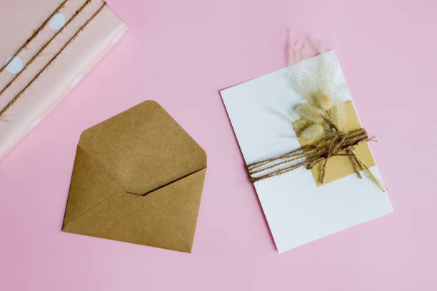 istock A pink box, letter and envelope over the pink background. 1414176194