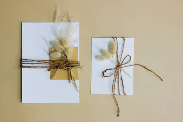 istock White letter with flower over the brown background. 1414176198