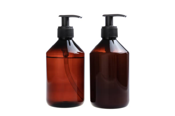 istock Brown bottles with shampoo and hair conditioner, isolated on white background. 1414176367