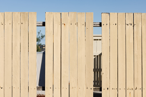 New wooden rural fence made of horizontal blue planks. Isolated with patch
