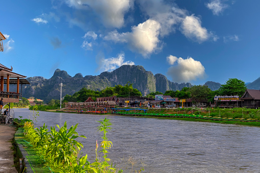 Vang Vieng Laos a beautiful city on the river with huge rising mountains and slow flowing river.