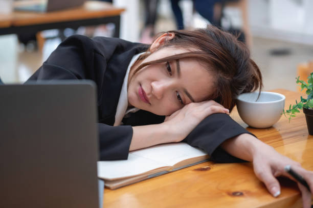 istock Burnout syndrome at work concept. exhausted overworked woman working in office.Concept Burnout Syndrome. 1414184872
