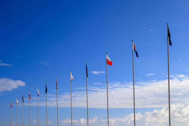 istock Flags on masts against the blue sky 1414186781