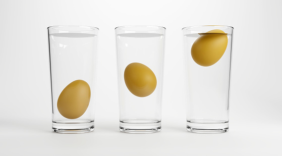 Eggs in water test on transparent glass , Egg freshness test on white background, 3d Rendering