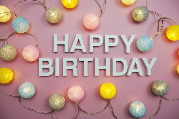 istock Happy Birthday alphabet letters on pink background 1414190888