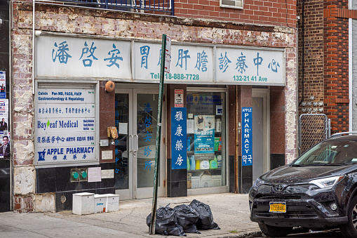 Flushing downtown, Queens, New York, NY, USA - July 2 2022: American Chinese pharmacy in 41st Avenue in the Flushing china town