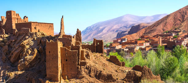Amazing view of a Kasbah's ruin on the way to Kasbah Ait Ben Haddou near Ouarzazate in the Atlas Mountains of Morocco. Artistic picture. Beauty world. Panorama Amazing view of a Kasbah's ruin on the way to Kasbah Ait Ben Haddou near Ouarzazate in the Atlas Mountains of Morocco. Artistic picture. Beauty world. ait benhaddou stock pictures, royalty-free photos & images