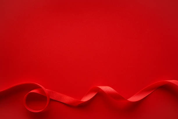 istock Red background with red satin ribbon frame, Love or Gift background 1414194321