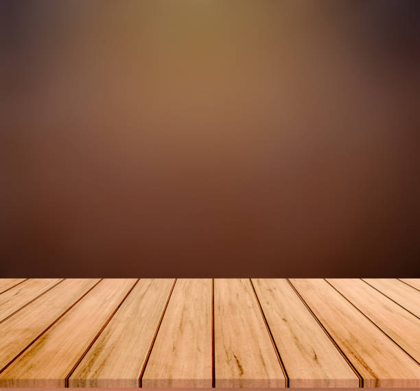 istock wood plank with abstract blur brown  background for product display 1414194354