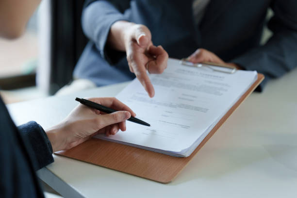 istock Real Estate Agent broker explain about agreement contract 1414194940