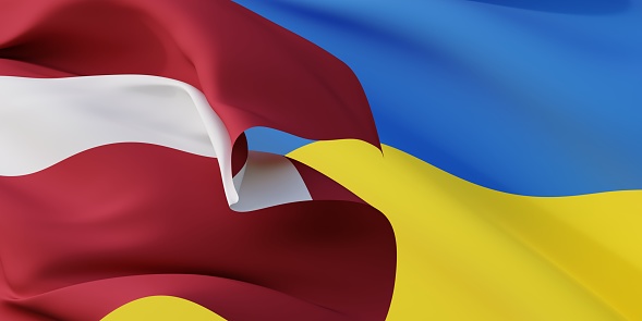 Latvian and Ukrainian flags flying in the wind. Latvia stand with Ukraine. 3D rendered image.