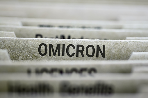 Omicron label on file folder organizer