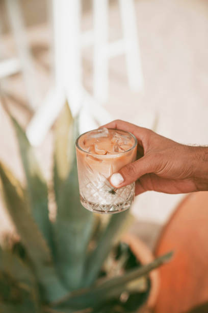 istock Beautiful woman is drinking cocktail 1414200579