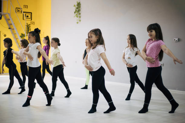 Children practicing in dancing in studio. stock photo