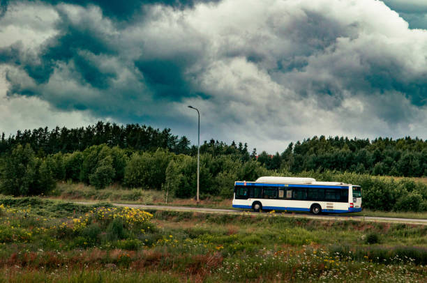 istock Bus driving through the city outskirts 1414206939