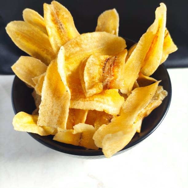 istock Crispy and savory banana chips, made from young bananas. 1414209404