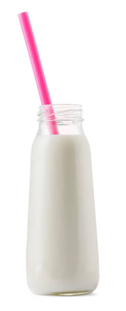 istock Glass cup of milk with a straw isolated on white 1414215064