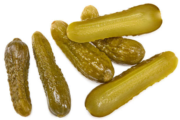 istock marinated pickled cucumbers with slices isolated on white background. Clipping path and full depth of field 1414215149