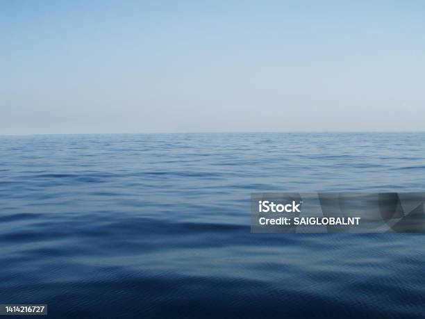 Pale Morning Sky And The Dead Calm Blue Sea Horizon Gradation Texture Stock Photo - Download Image Now