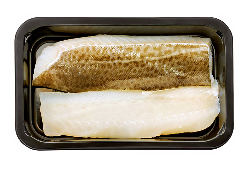 cod filet ready cook in a plastic tray isolated on white