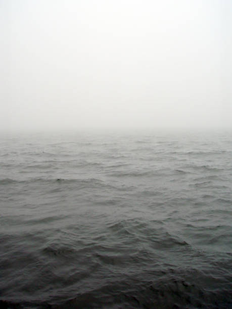 istock Dark winter misty gray sea horizon texture. 1414217734