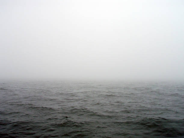 istock Dark winter misty gray sea horizon texture. 1414217736