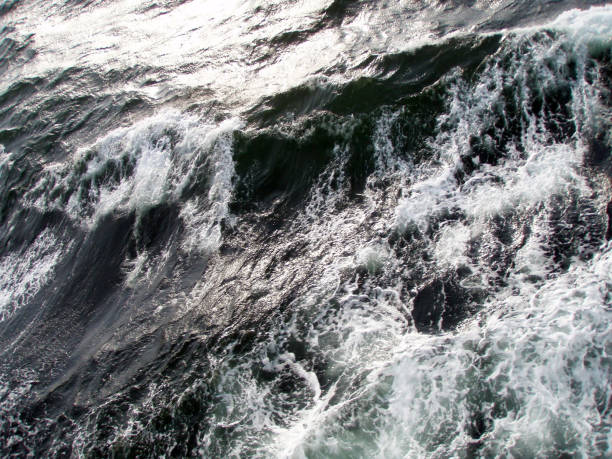 istock Dark ocean surface and rough wave image processed photograph, taken from the sailing boat. 1414217795
