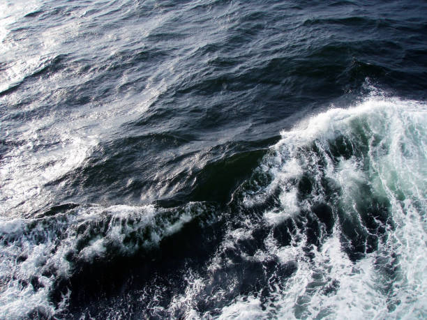 istock Dark ocean surface and rough wave image processed photograph, taken from the sailing boat. 1414217798