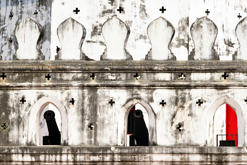 Bangkok, Thailand: Phra Sumen Fort - crenelated battlement with cannons and cross-shaped balistrarias - octagonal fort located at the mouth of Khlong Rop Krung (the moat) where it meets the Chao Phraya river, today the corner of Phra Sumen and Phra Athit Roads.