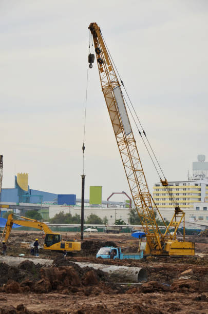 istock Asian labor people and thai labour workers use machine and heavy machinery working builder new building tower at construction site high-rise building on scaffold at capital city in Bangkok, Thailand 1414219621