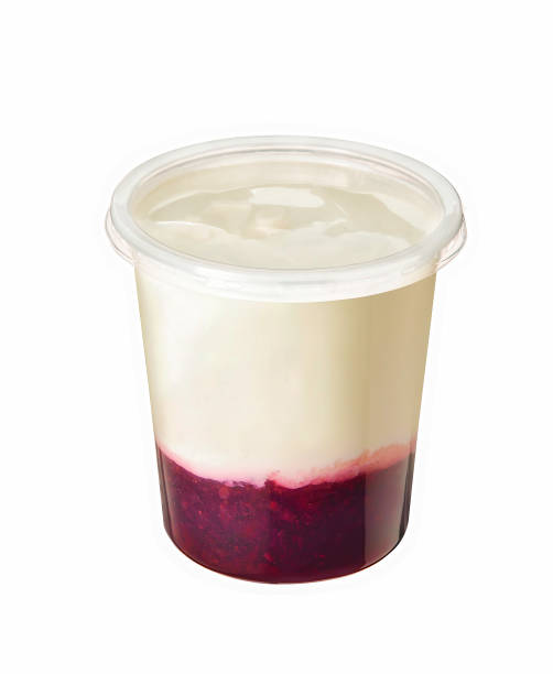 istock vanilla custard with red berry in plastic jar isolated on white 1414219764