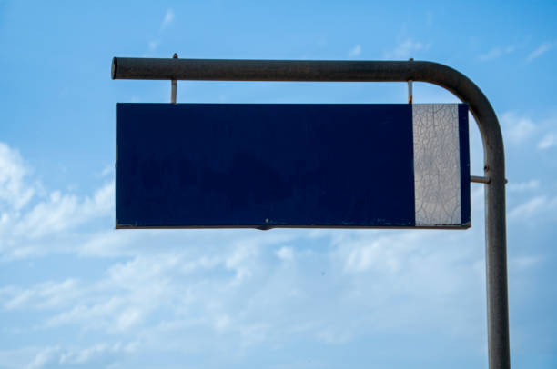 istock blank street sign against sky and clouds 1414220829