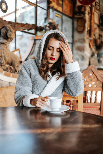 istock Woman drinking her coffee at morning. 1414221018