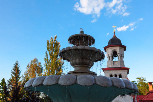istock marble fountain and church steeple 1414221030