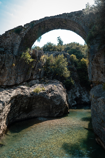 The center of attraction. Köprülü Canyon National Park with its historical and geographical beauty. View of the old bridge over the clear clean canyon water.