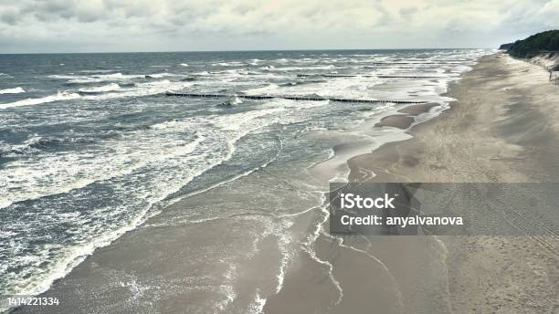 Unquiet Baltic Sea After A Storm Polish Baltic Shore Near Dziwnow And Trzesacz Towns Empty Beach Stormy Waves Stock Photo - Download Image Now