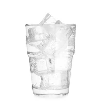 Glass of soda water with ice isolated on white